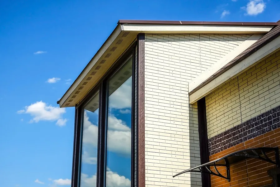 Close-up of tinted corner windows on a home